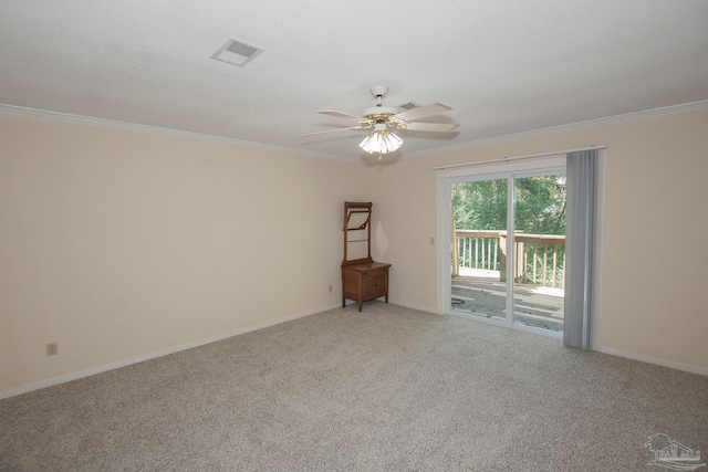 unfurnished room featuring carpet flooring, a textured ceiling, ornamental molding, and ceiling fan