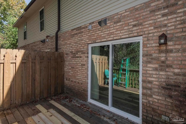 view of home's exterior featuring a wooden deck