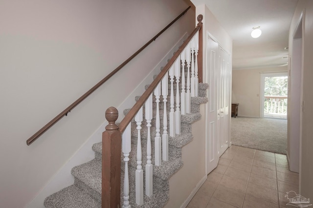 stairway featuring tile patterned floors