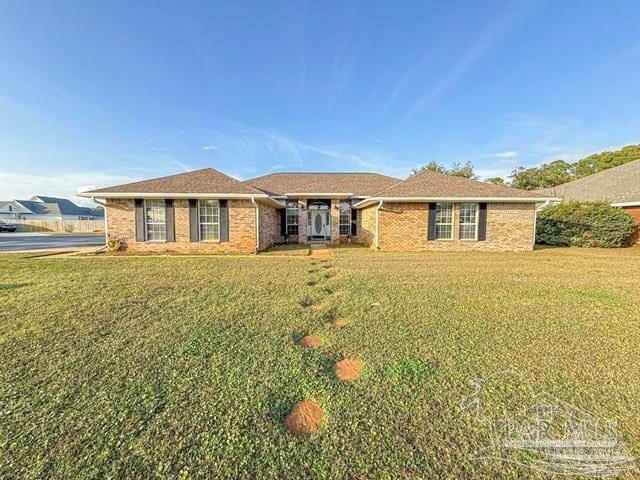 5020 Lantana Dr, Gulf Breeze, FL 32563 - single story home with a front lawn and brick siding