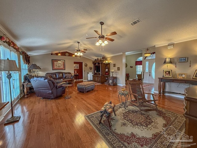 5020 Lantana Dr, Gulf Breeze, FL 32563 - living area featuring wood finished floors, a textured ceiling, ceiling fan, ornamental molding, and plenty of natural light
