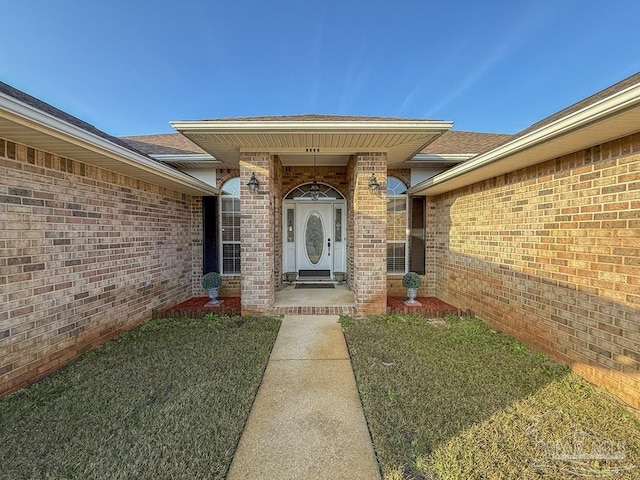 5020 Lantana Dr, Gulf Breeze, FL 32563 - property entrance with brick siding and a yard