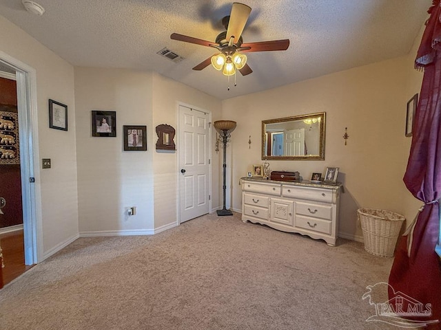 5020 Lantana Dr, Gulf Breeze, FL 32563 - bedroom with light colored carpet, baseboards, ceiling fan, and a textured ceiling