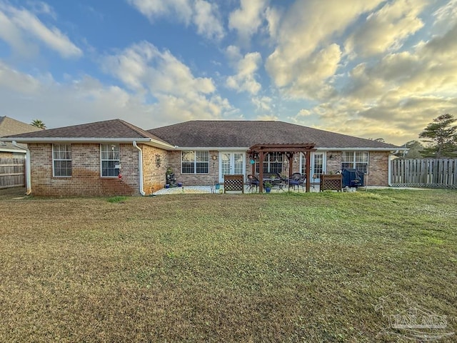 5020 Lantana Dr, Gulf Breeze, FL 32563 - back of house featuring a pergola, brick siding, a patio area, and french doors