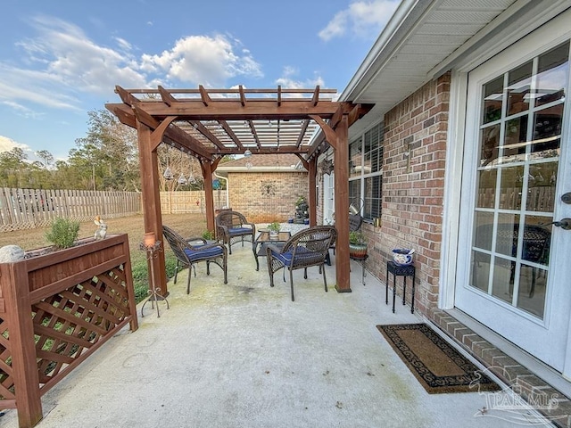 5020 Lantana Dr, Gulf Breeze, FL 32563 - view of patio with an outdoor hangout area, a pergola, and a fenced backyard