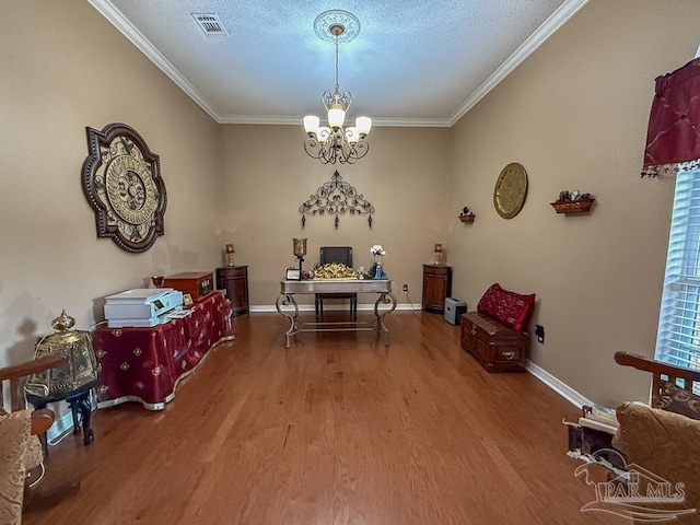 5020 Lantana Dr, Gulf Breeze, FL 32563 - dining room featuring wood finished floors, crown molding, a chandelier, a textured ceiling, and baseboards