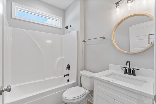 full bathroom featuring vanity, bathtub / shower combination, and toilet