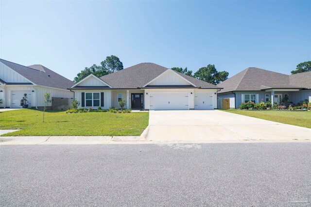 ranch-style house featuring a garage and a front yard