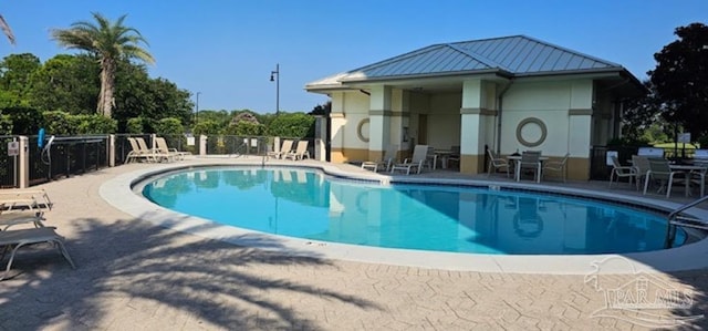 view of swimming pool featuring a patio area