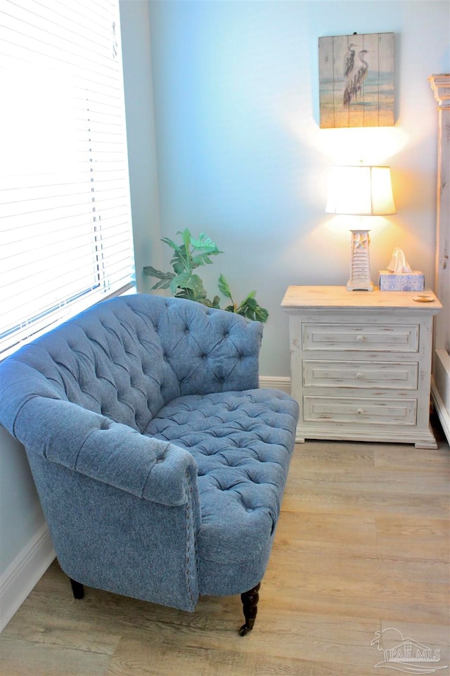 sitting room featuring light hardwood / wood-style flooring