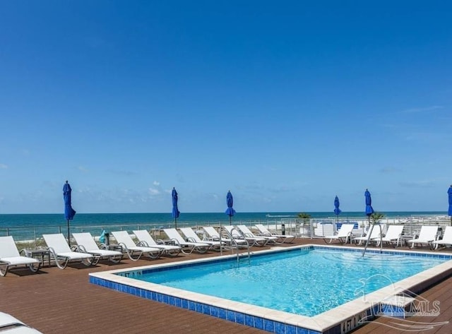 view of pool featuring a water view