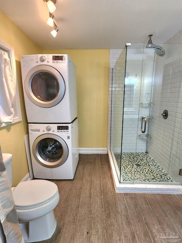 clothes washing area with stacked washer / drying machine