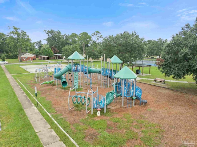 view of playground with a lawn