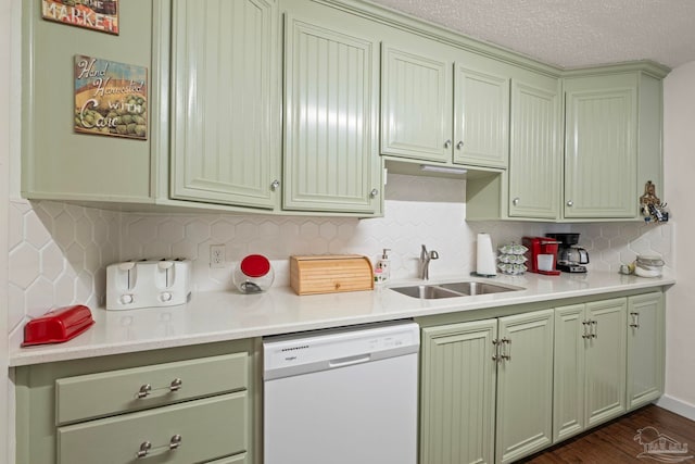 kitchen with decorative backsplash, a textured ceiling, white dishwasher, dark hardwood / wood-style floors, and sink