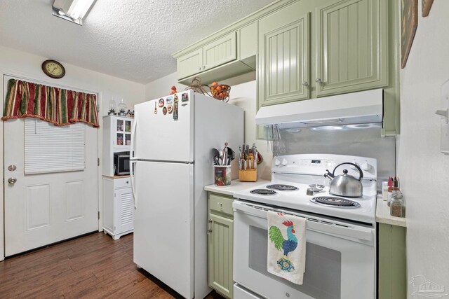 kitchen with white appliances, a textured ceiling, green cabinetry, and dark hardwood / wood-style floors