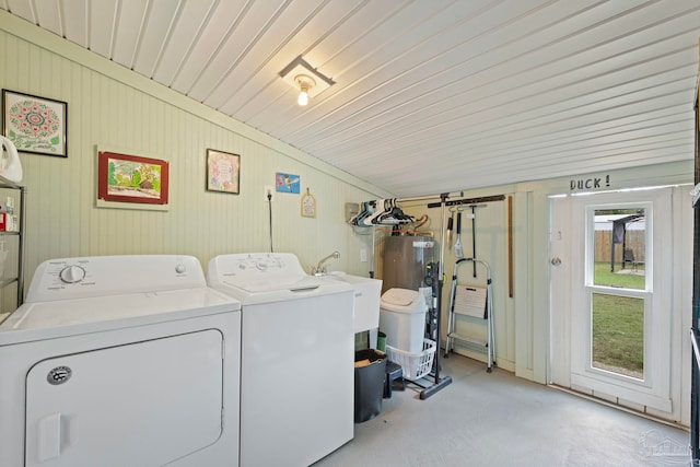 laundry area featuring gas water heater, sink, and independent washer and dryer