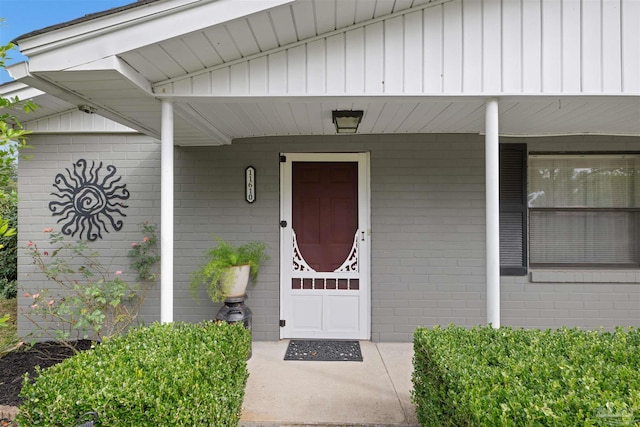 doorway to property featuring a porch