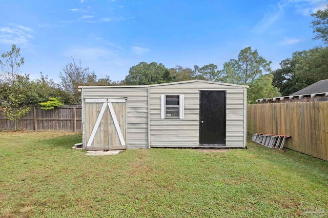 view of outdoor structure with a lawn