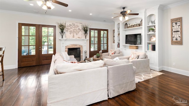 living room with dark wood-type flooring, ceiling fan, french doors, and ornamental molding