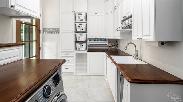 kitchen with white cabinetry and sink