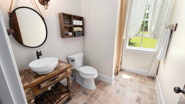 bathroom with toilet and sink