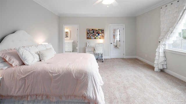 bedroom with ceiling fan, connected bathroom, carpet flooring, and crown molding