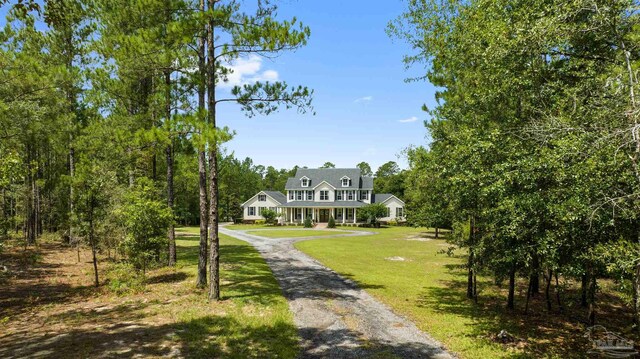 view of front of house featuring a porch and a front lawn