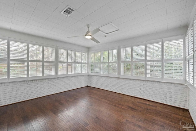 unfurnished sunroom featuring ceiling fan