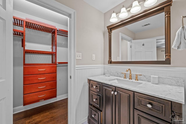 bathroom featuring wood-type flooring and vanity