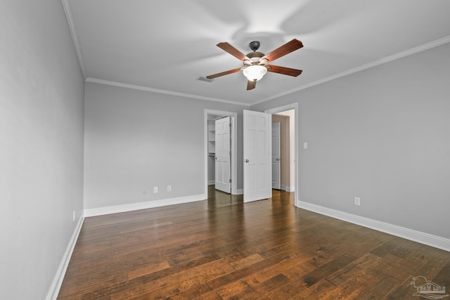 unfurnished room featuring crown molding, dark wood-type flooring, and ceiling fan