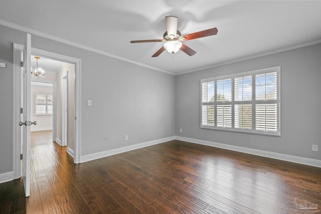 empty room with crown molding, dark hardwood / wood-style floors, and ceiling fan with notable chandelier