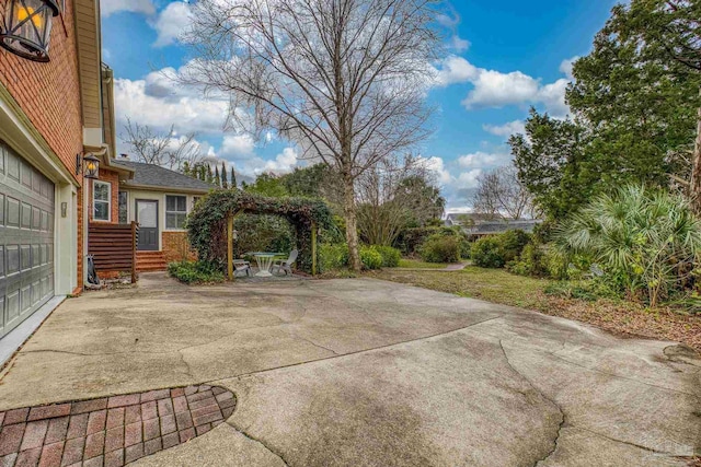 view of patio / terrace featuring a garage