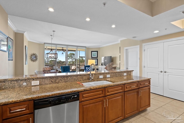 kitchen with light tile patterned floors, dishwasher, sink, and light stone counters