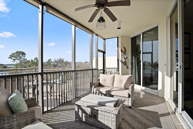 sunroom / solarium with ceiling fan