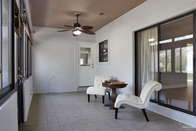 sunroom featuring wooden ceiling and ceiling fan