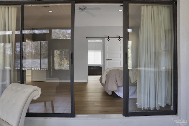 interior space featuring hardwood / wood-style floors and ceiling fan