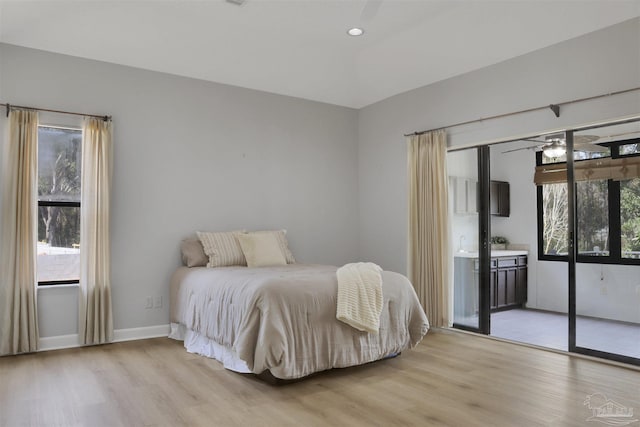 bedroom featuring light hardwood / wood-style flooring and access to outside