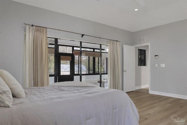 bedroom with hardwood / wood-style floors