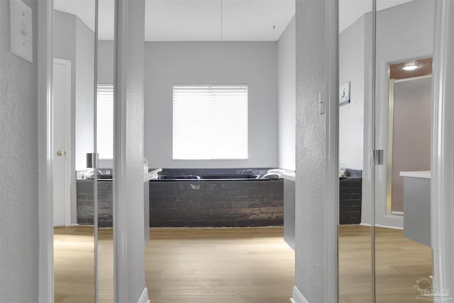 hallway with light wood-type flooring