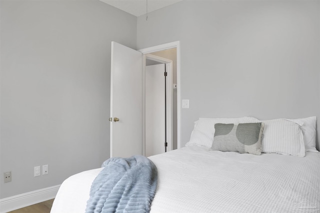 bedroom with hardwood / wood-style floors