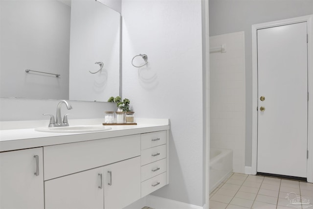 bathroom with tile patterned flooring, vanity, and shower / washtub combination