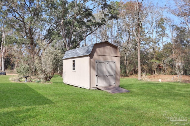 view of outdoor structure with a lawn