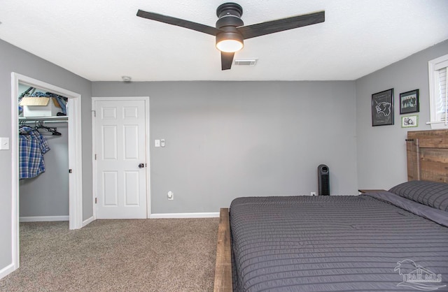 bedroom with ceiling fan, a closet, and carpet