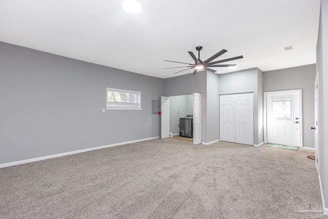 unfurnished bedroom with ceiling fan and light colored carpet