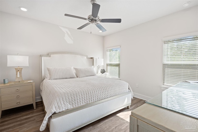 bedroom featuring dark hardwood / wood-style flooring and ceiling fan