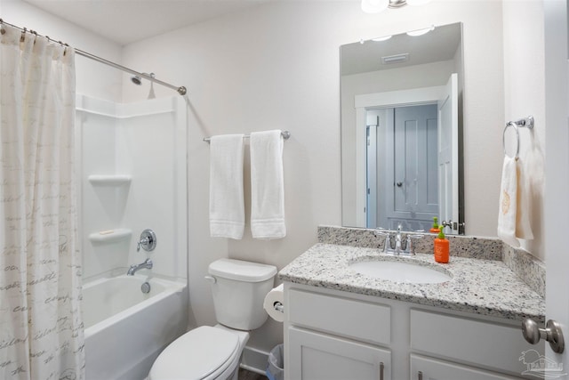 full bathroom featuring vanity, toilet, and shower / tub combo