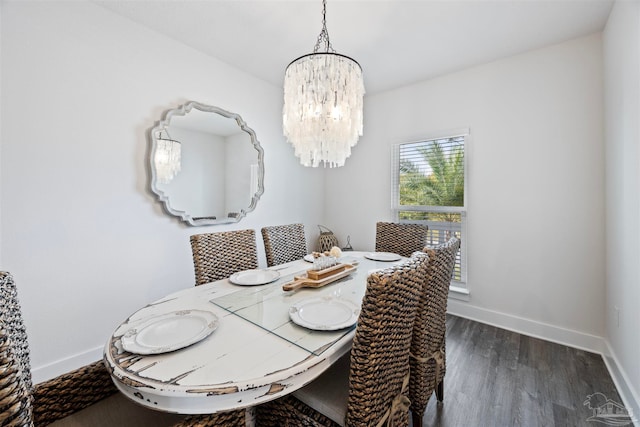 dining room featuring a chandelier and dark hardwood / wood-style floors