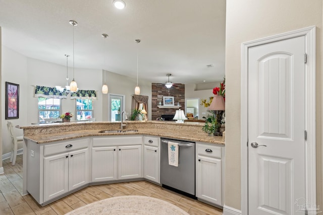 kitchen featuring stainless steel dishwasher, white cabinetry, ceiling fan, light wood-type flooring, and light stone countertops