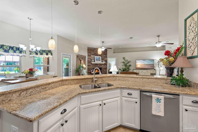 kitchen featuring sink, dishwasher, light stone countertops, and white cabinetry