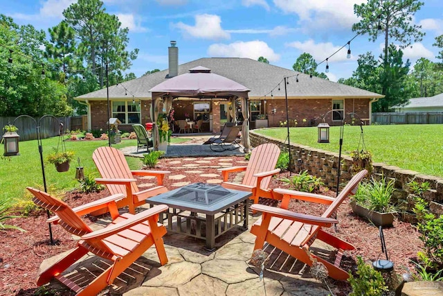 view of patio / terrace featuring a gazebo and an outdoor fire pit